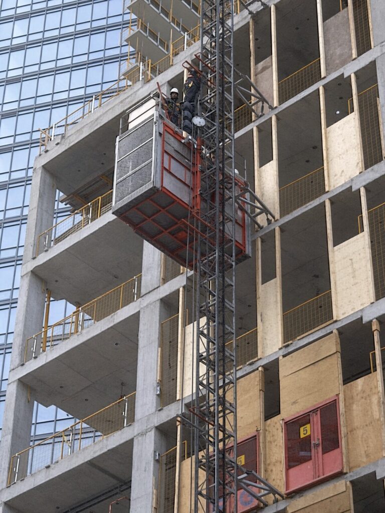 Construction hoist rental and elevator installation on high-rise site in Toronto and Burlington, Ontario